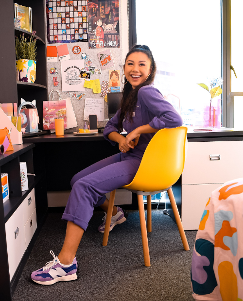 Girl sitting at desk in her room at Scape