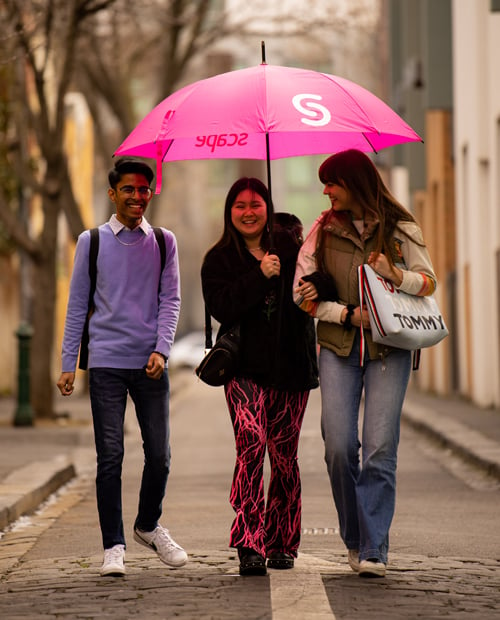 Students in Melbourne with Scape umbrella