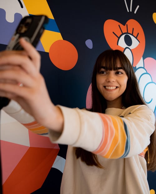 Student taking a selfie at Scape