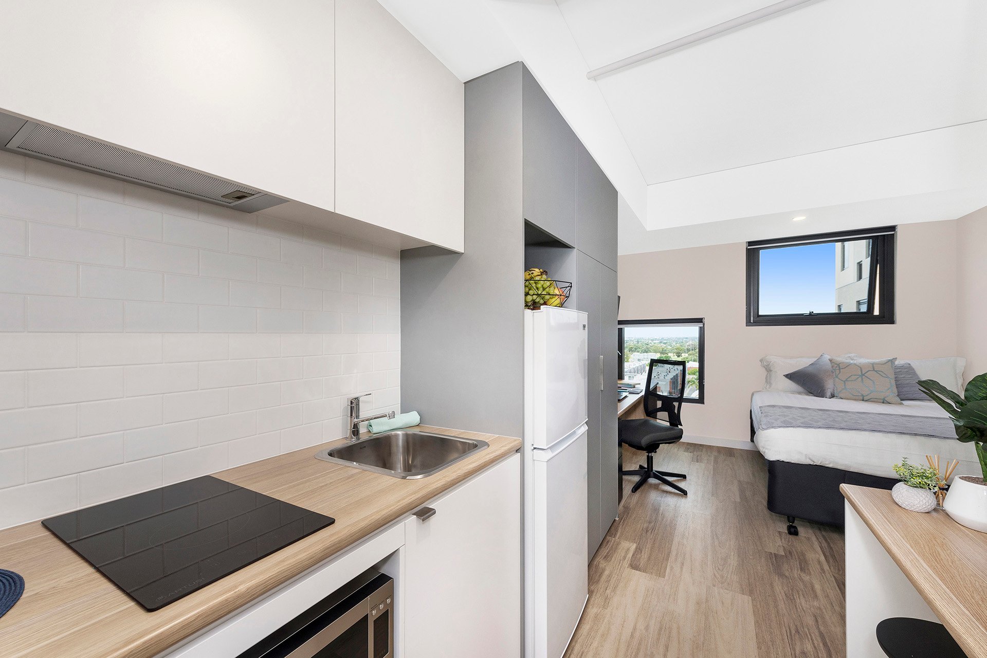 Kitchen and study area in medium studio apartment